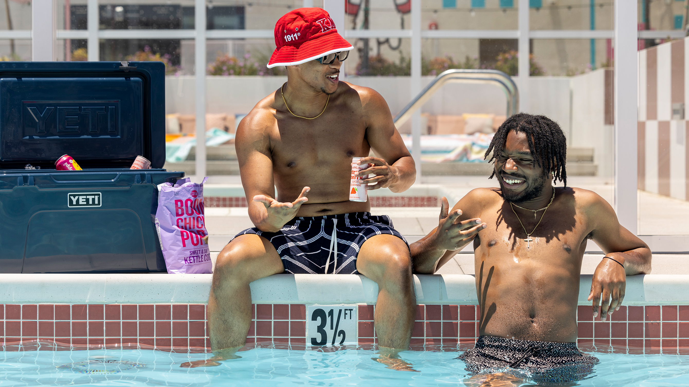 young adults lounging by pool